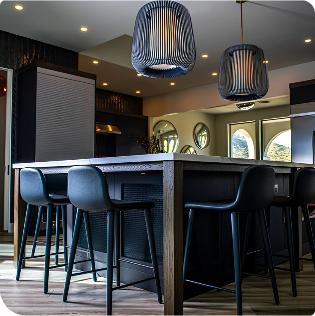 Rectangle 15 (1) Modern kitchen with island and pendant lights.